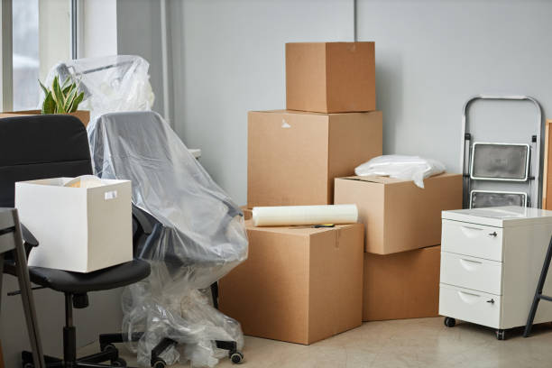 Relocation to a new office with packed cardboard boxes and furniture oneworldlogixcom office relocation